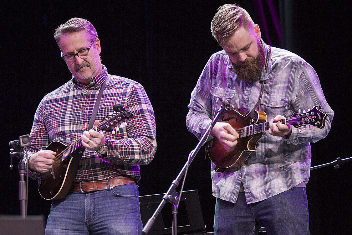 Two members of a group class for mandolins perform.